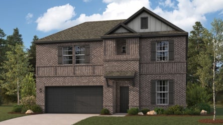 A brick house with a garage.