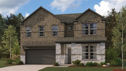 A stone house with a garage.