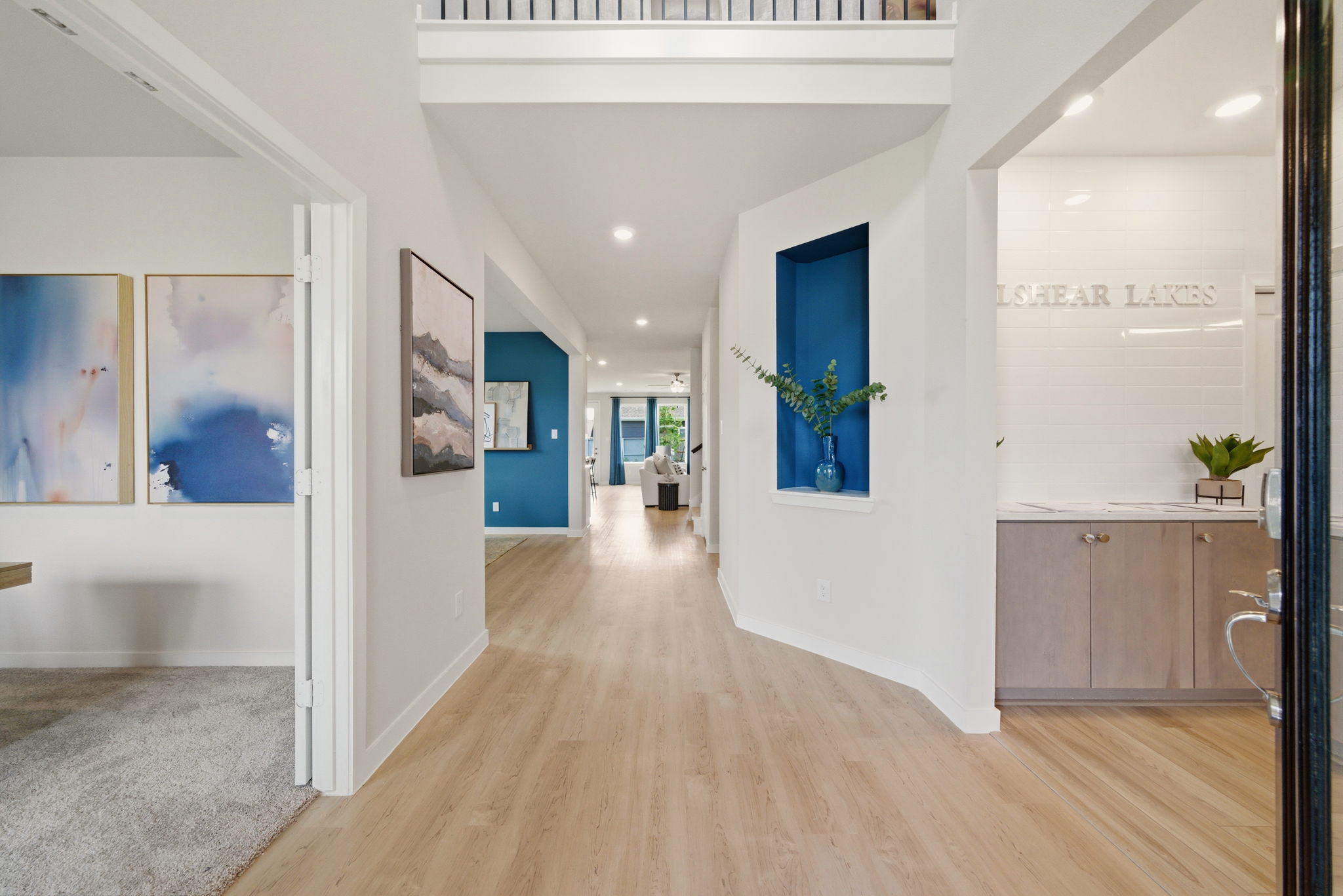 A room with white walls and a wood floor.