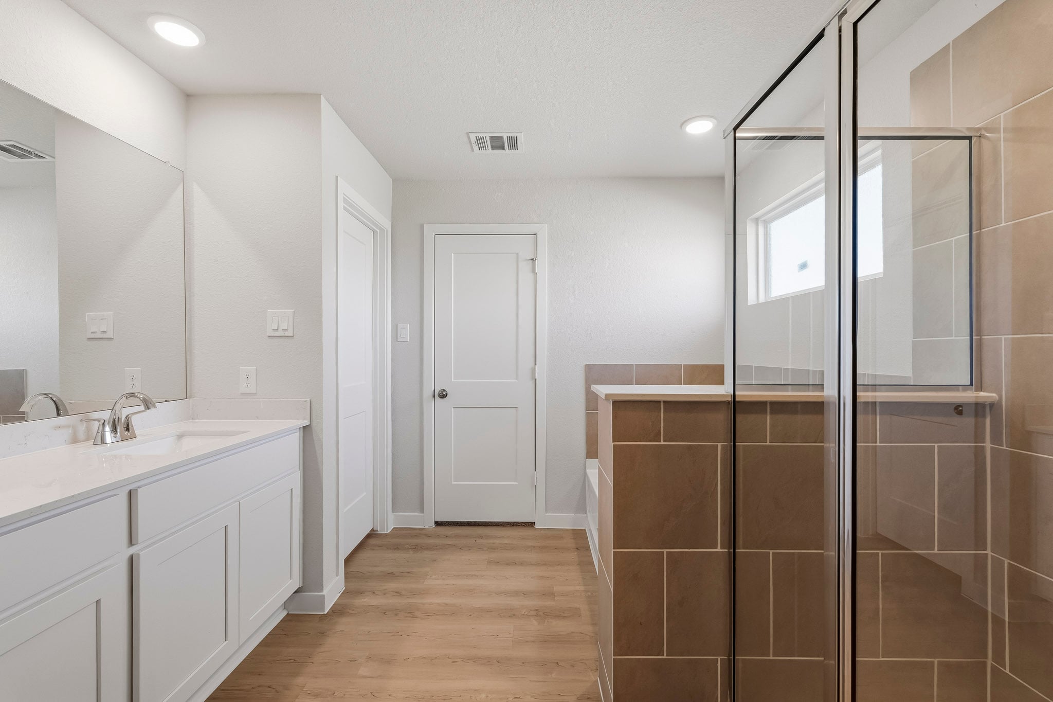 A bathroom with a glass shower.