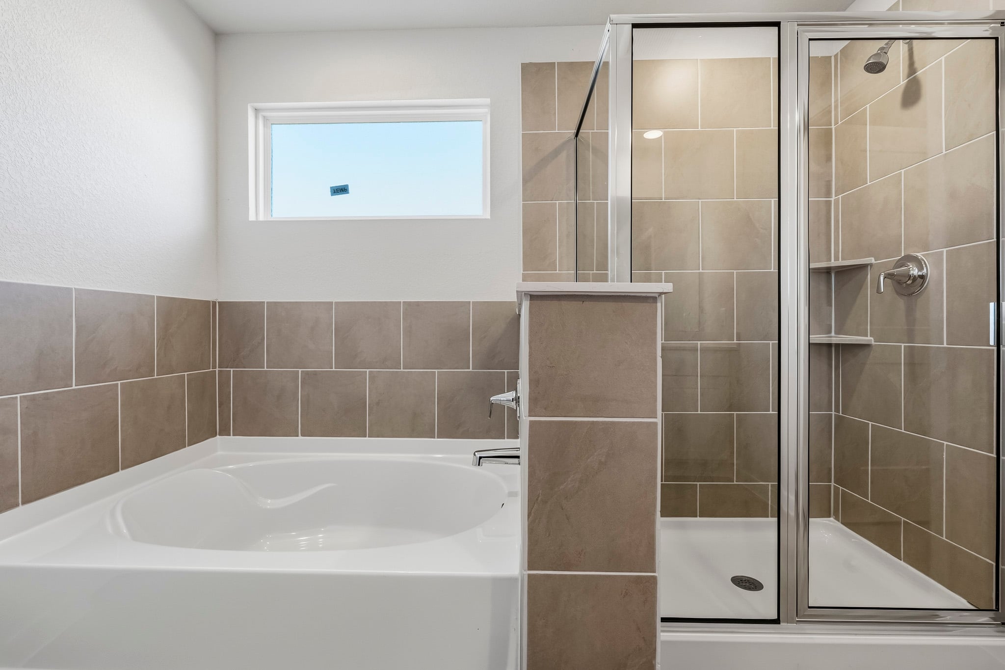 A bathroom with a glass shower.