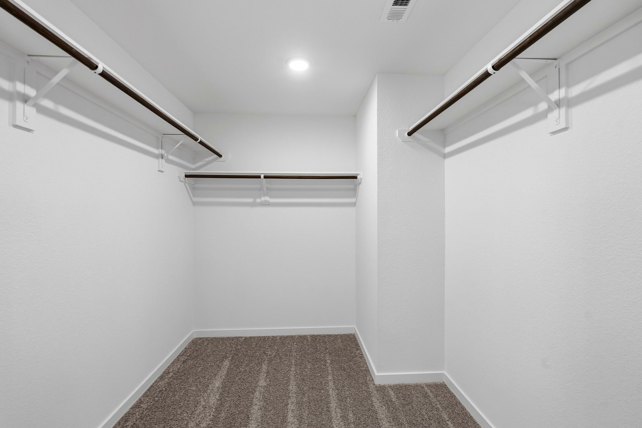 A hallway with white walls.