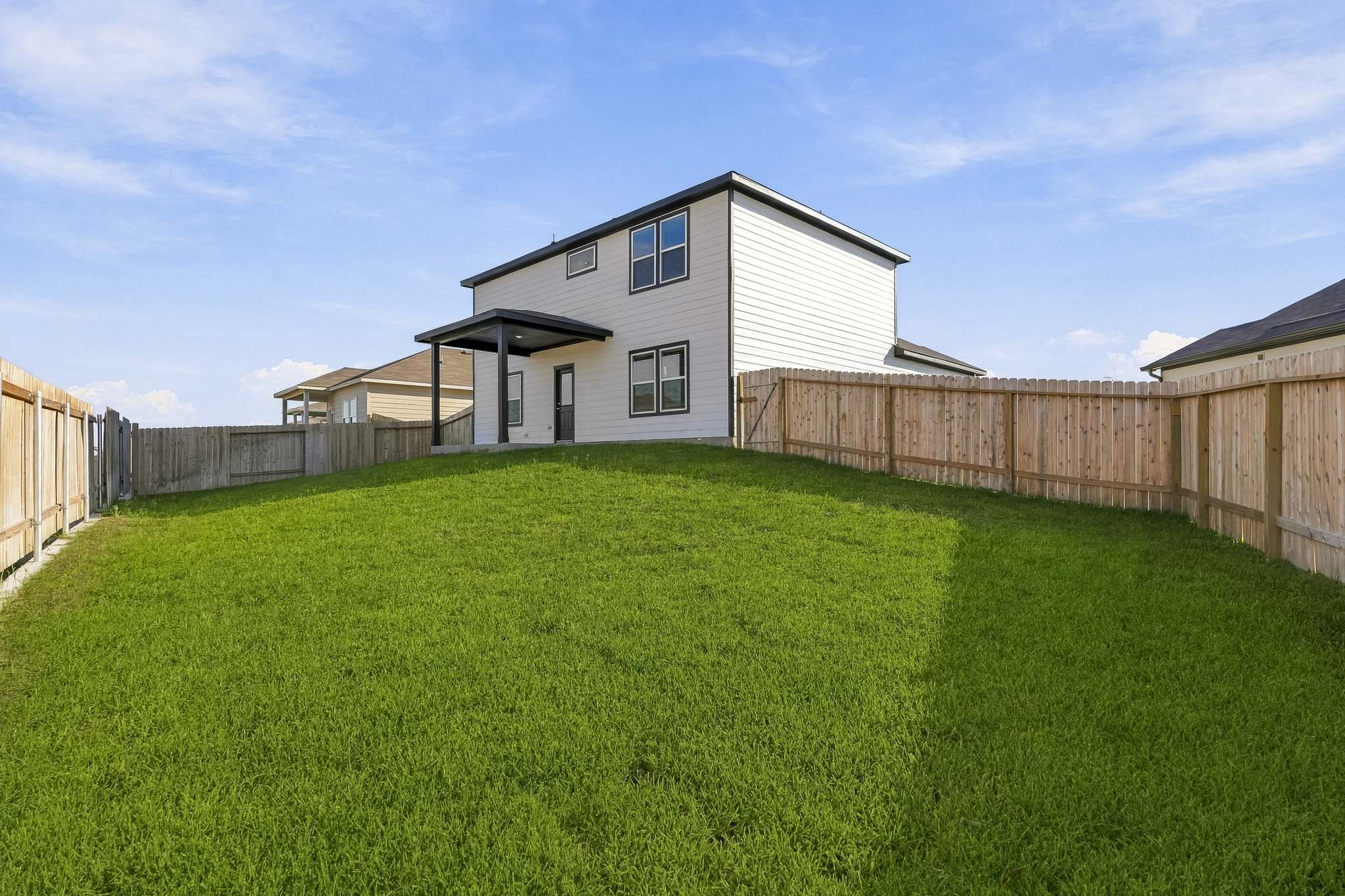 A house with a fence around it.