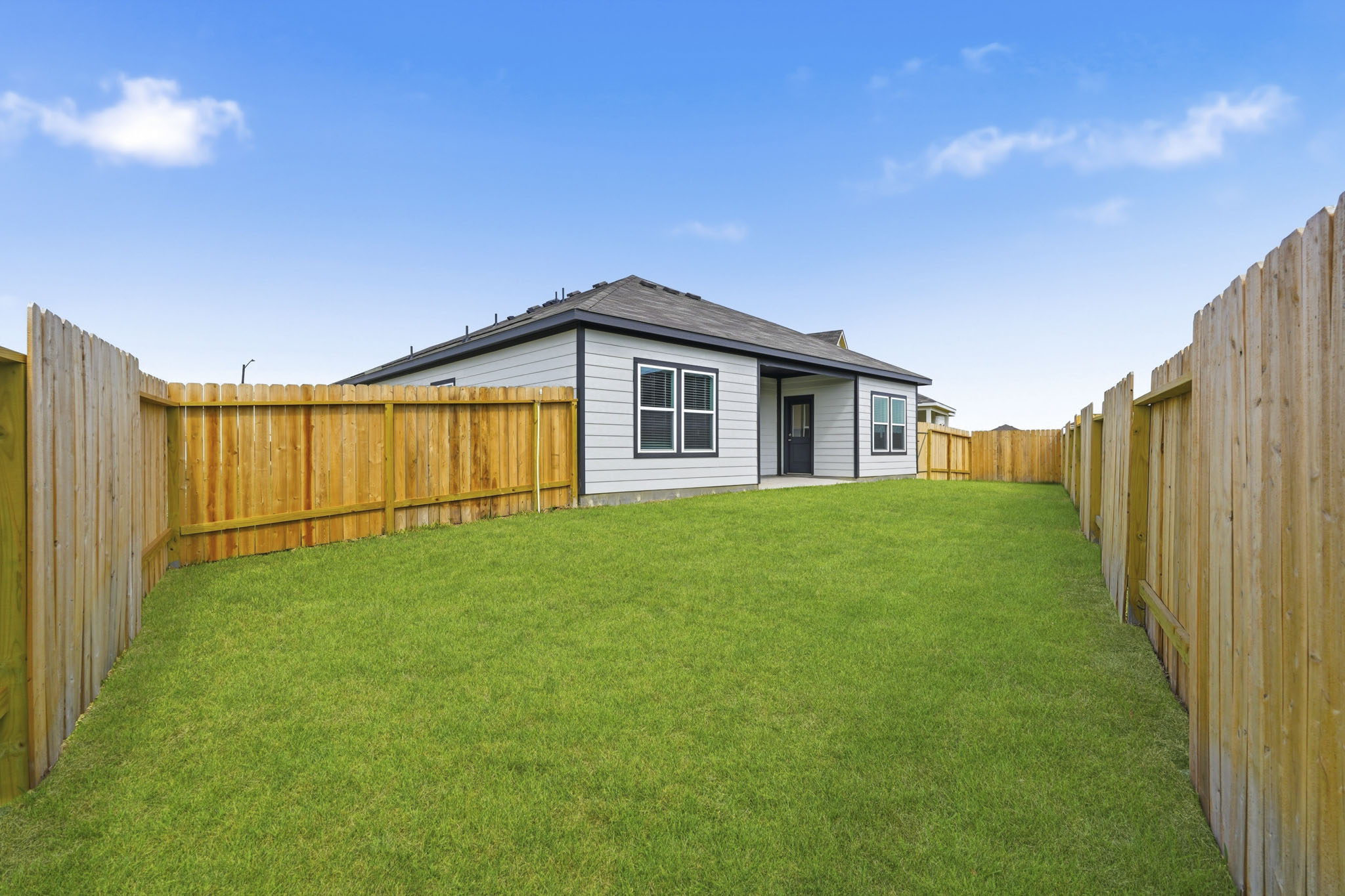 A house with a fence around it.