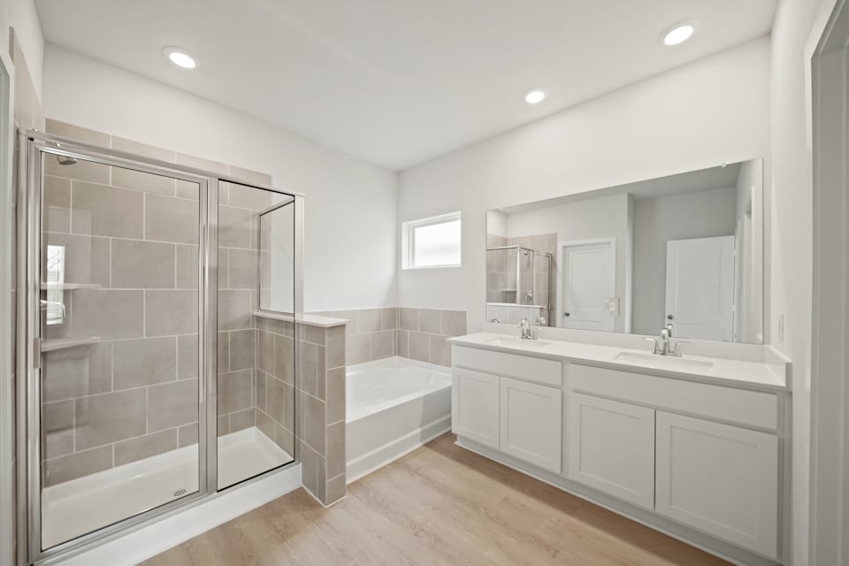 A bathroom with a glass shower.