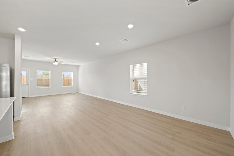 A room with a wood floor and a wood floor.