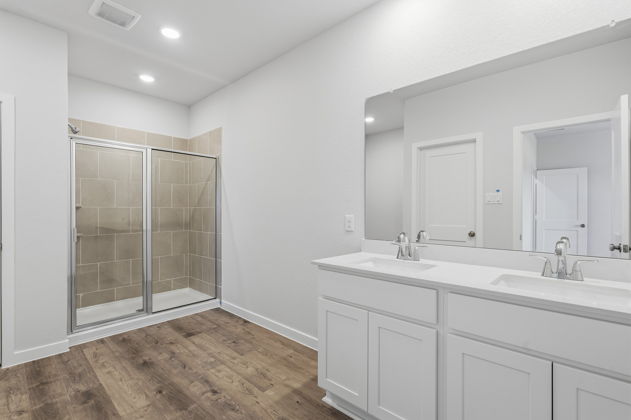 A bathroom with a glass shower.
