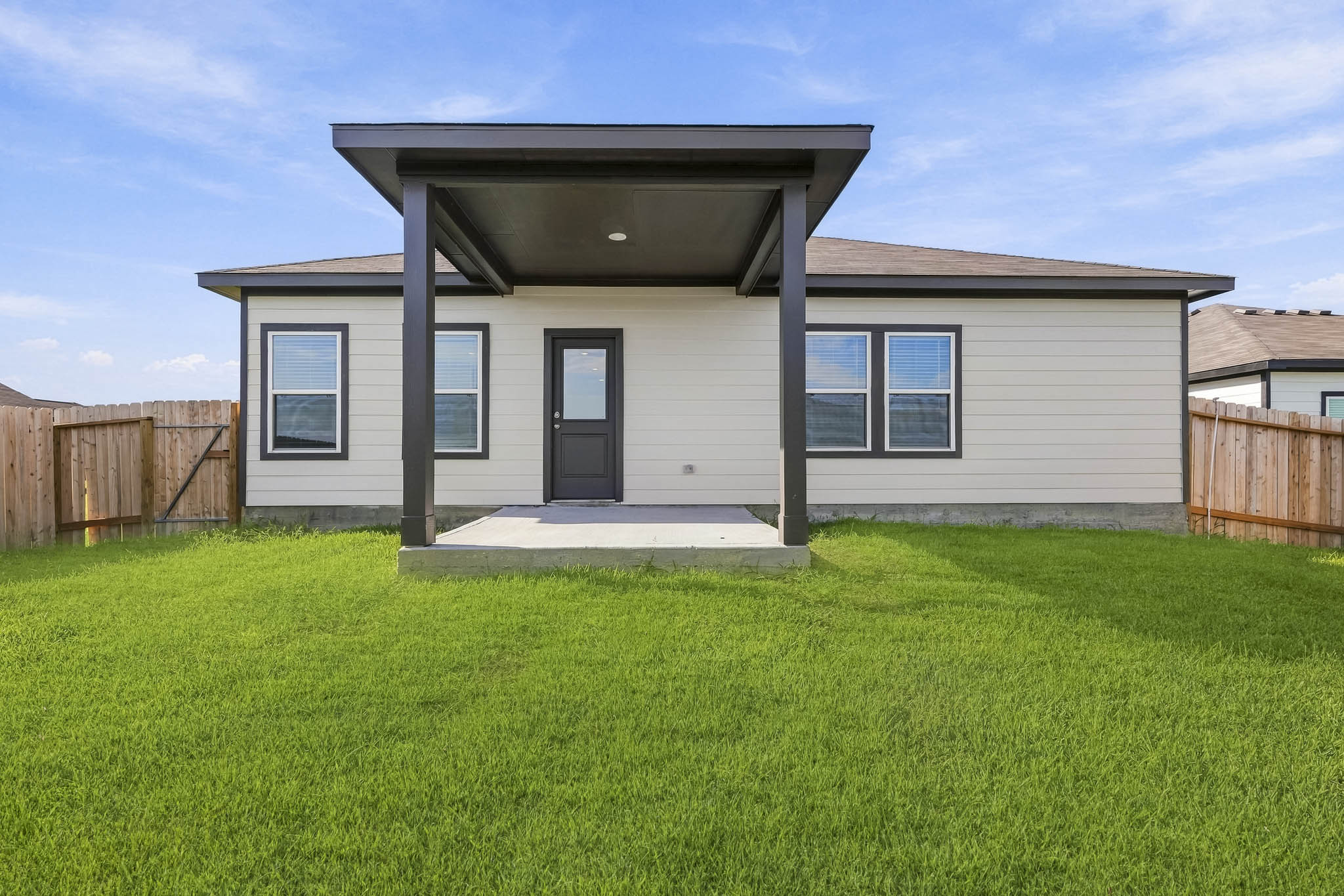 A house with a grass yard.