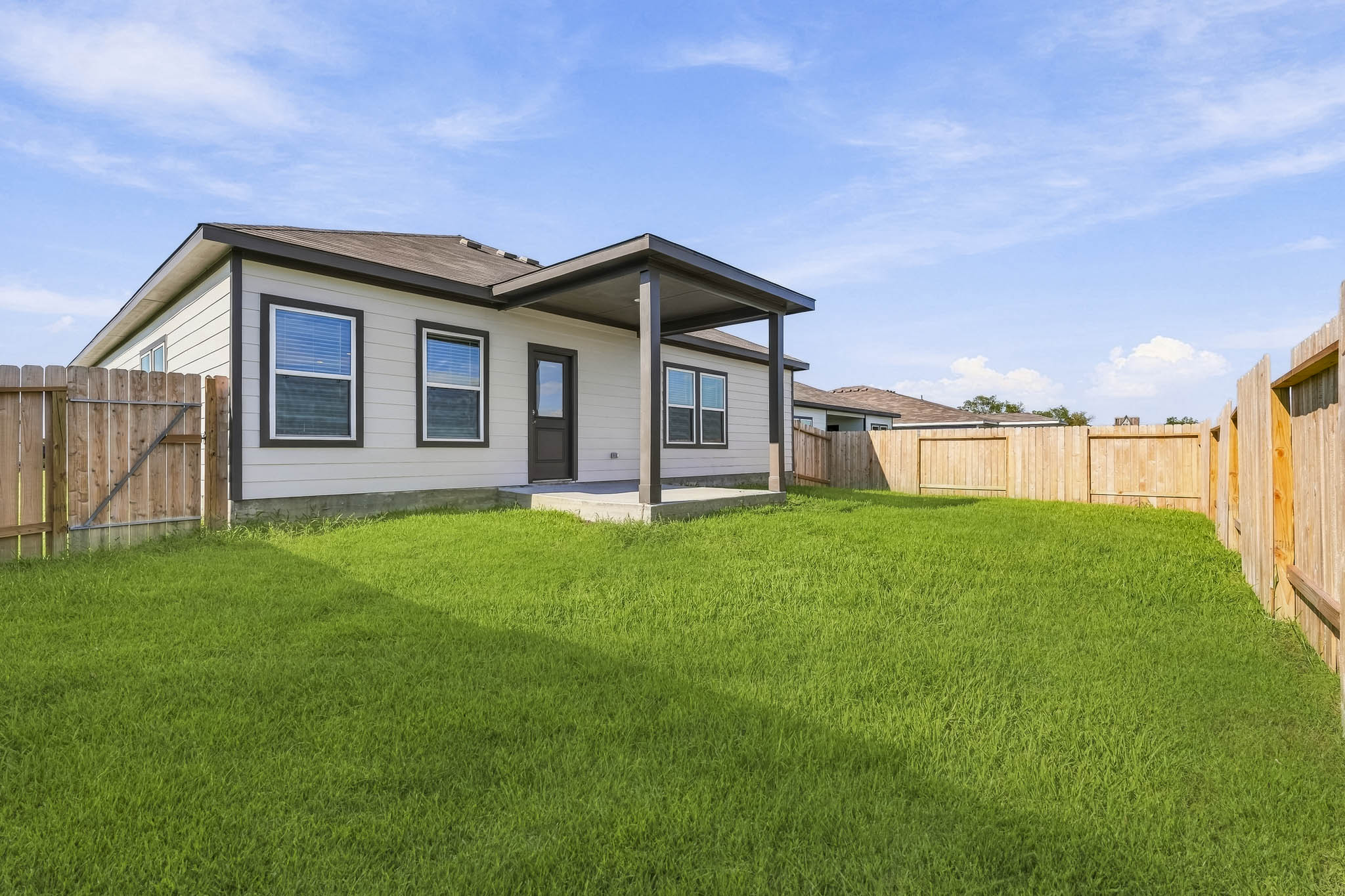 A house with a fence around it.