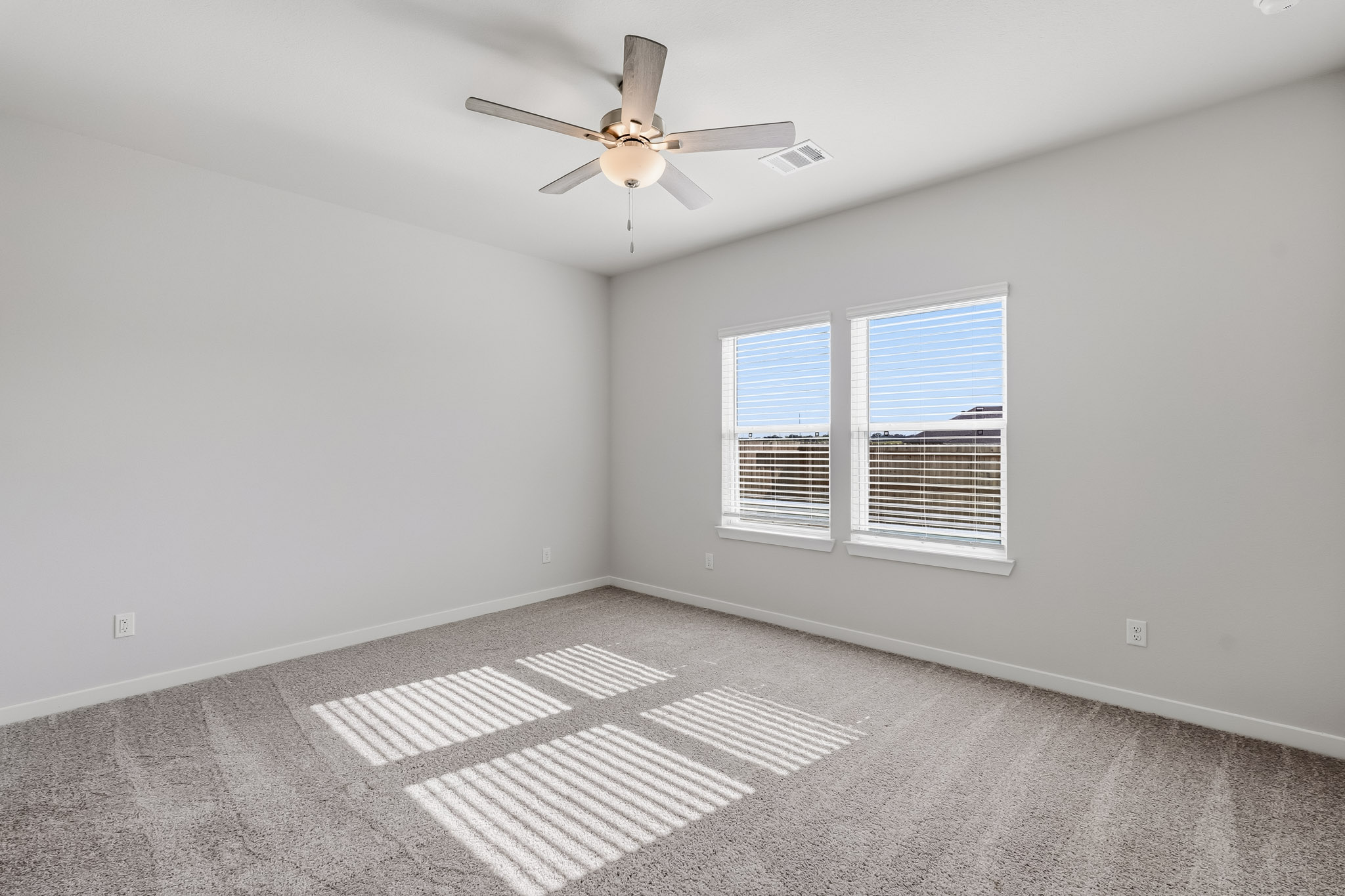 A ceiling fan in a room.
