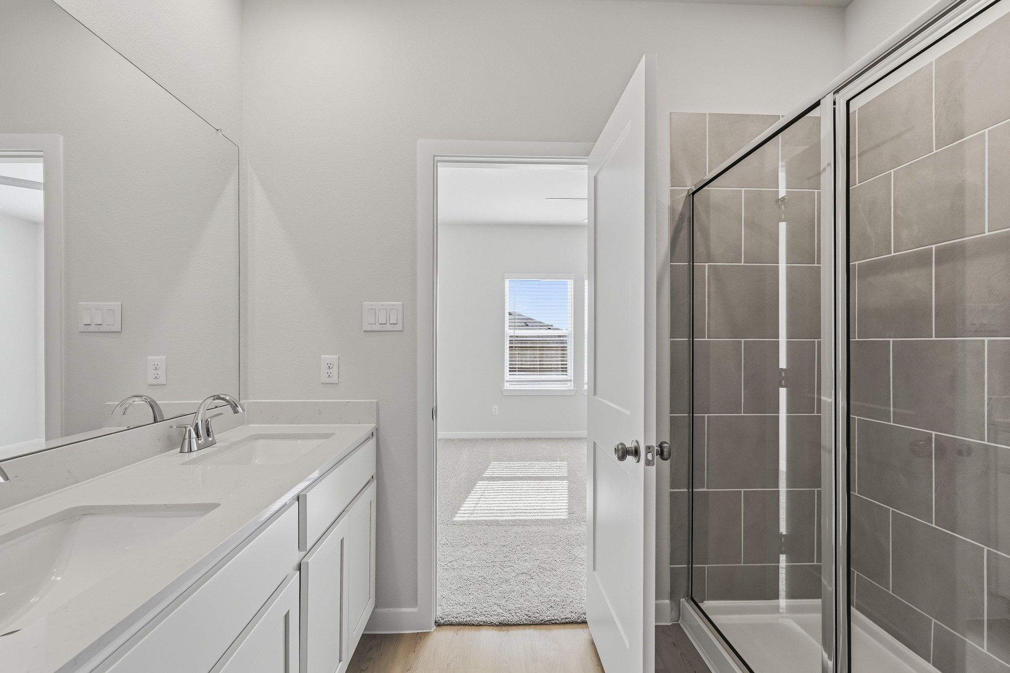 A bathroom with a glass shower.