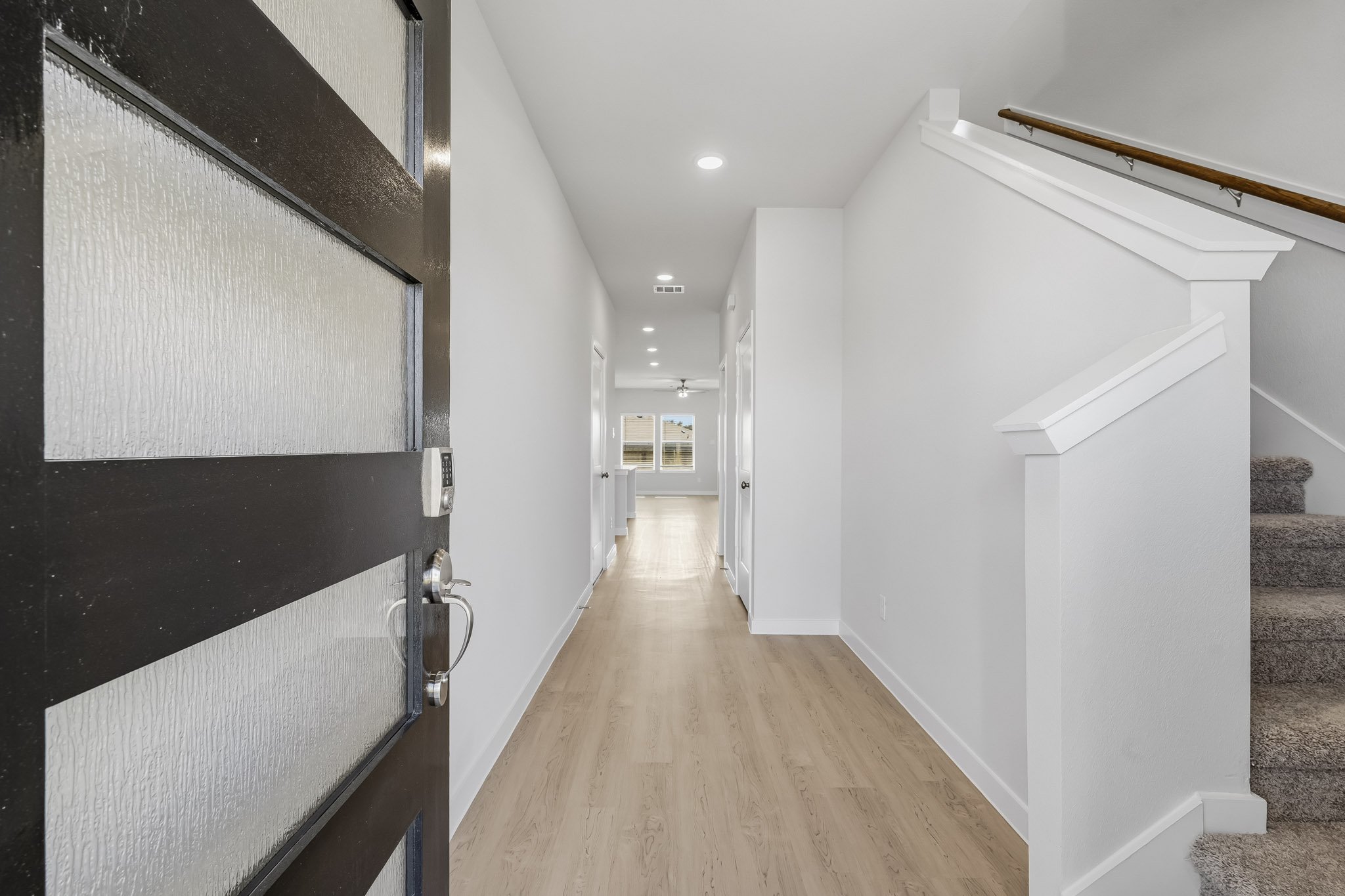 A hallway with black walls.