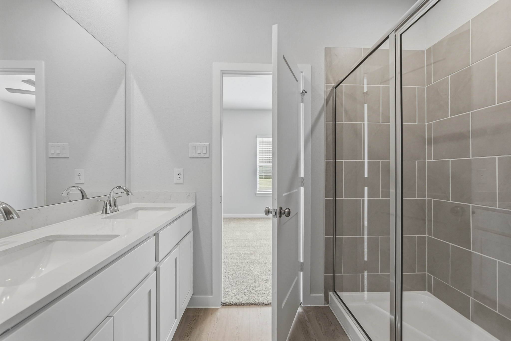 A bathroom with a glass shower.