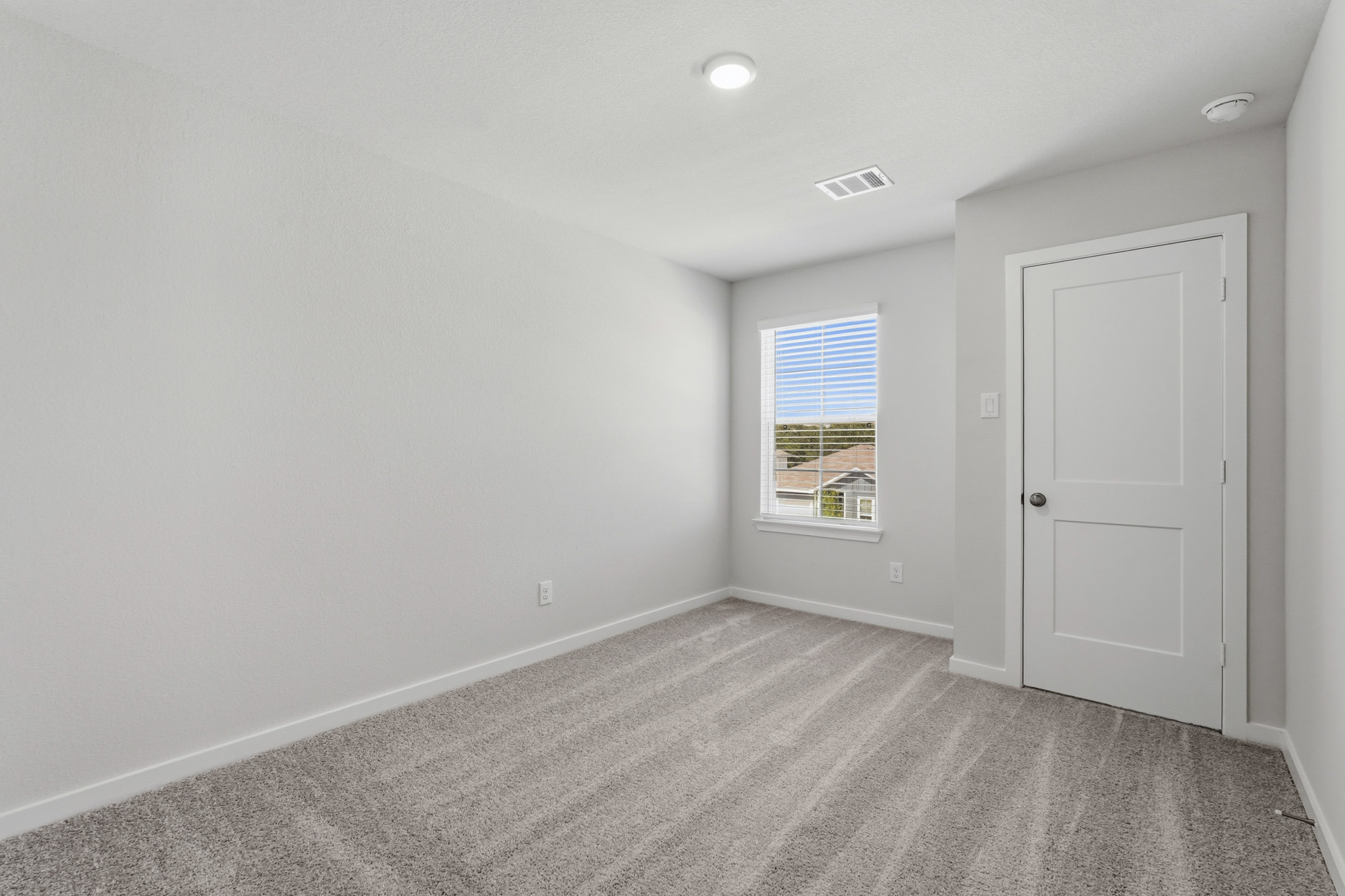 A room with a door and a window.