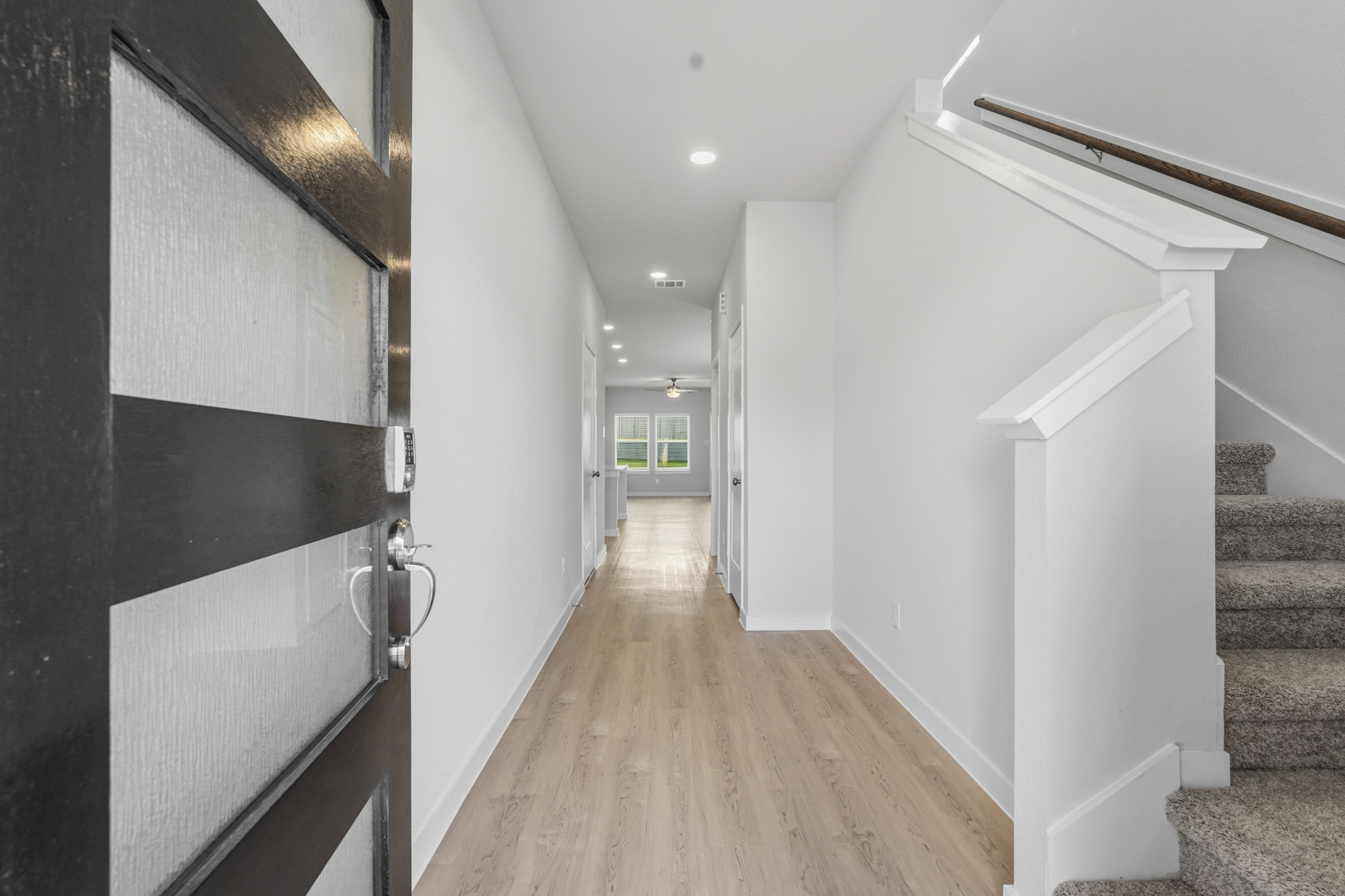 A hallway with white walls.