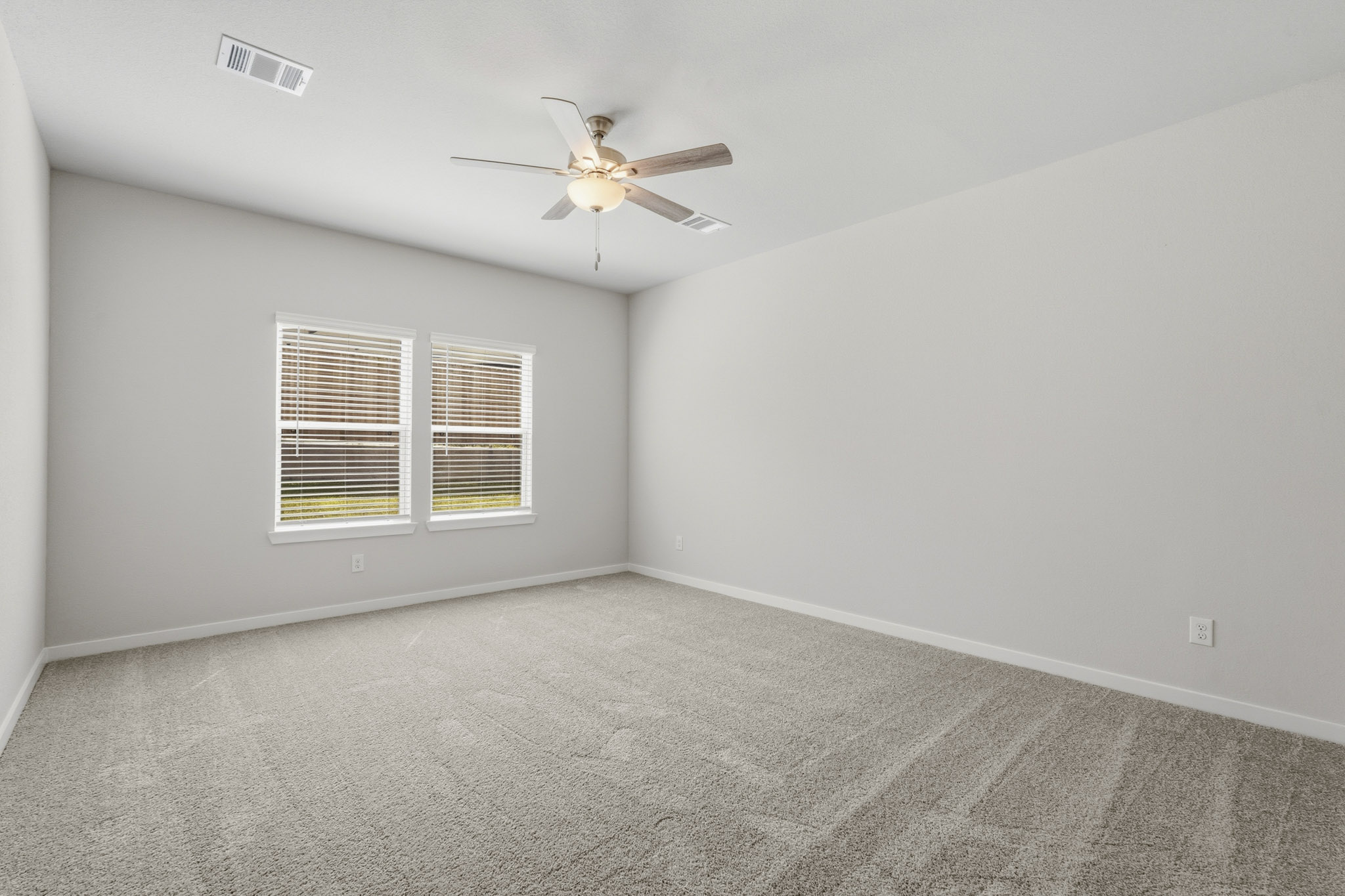 A ceiling fan in a room.