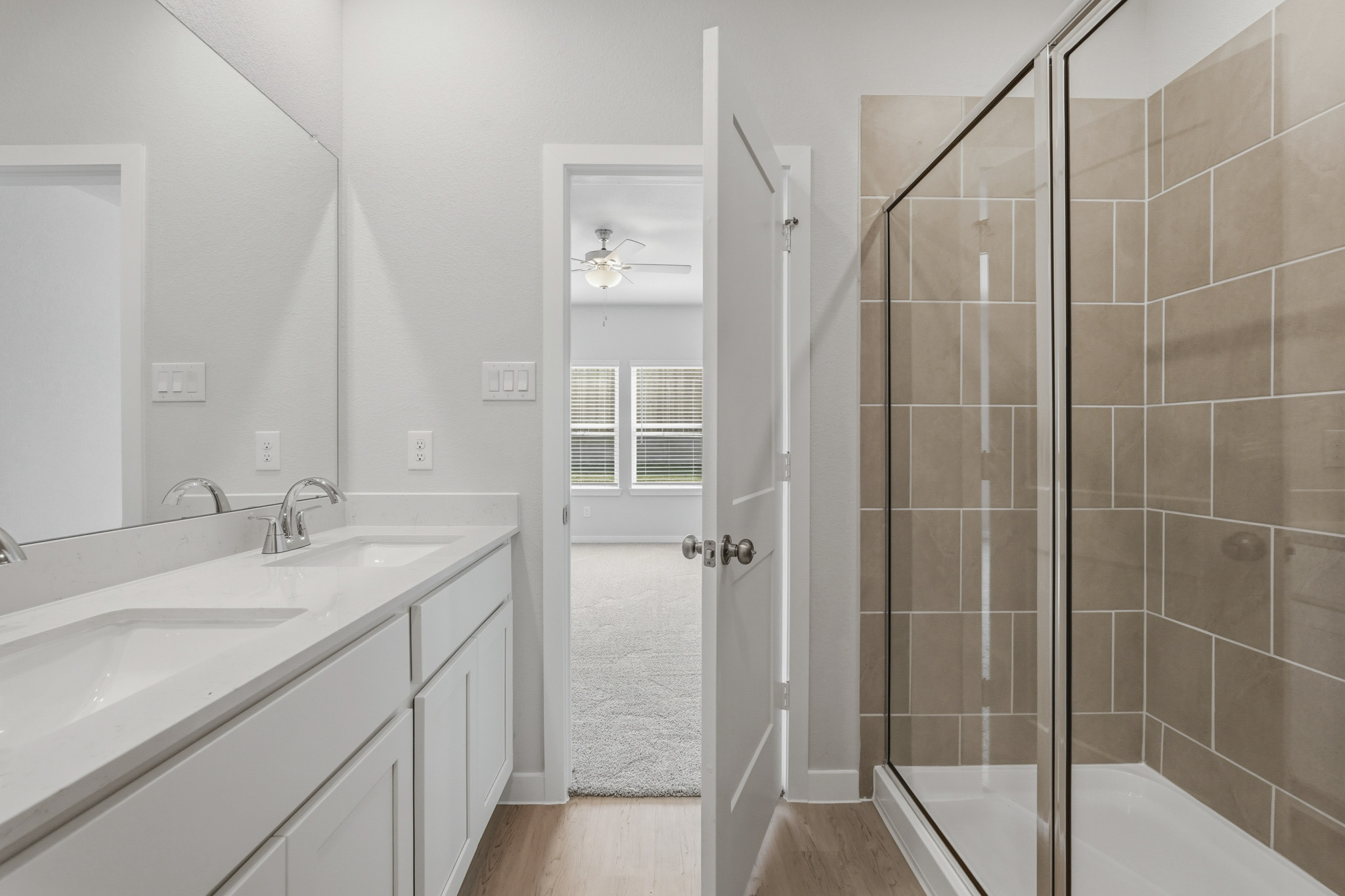 A bathroom with a glass shower.