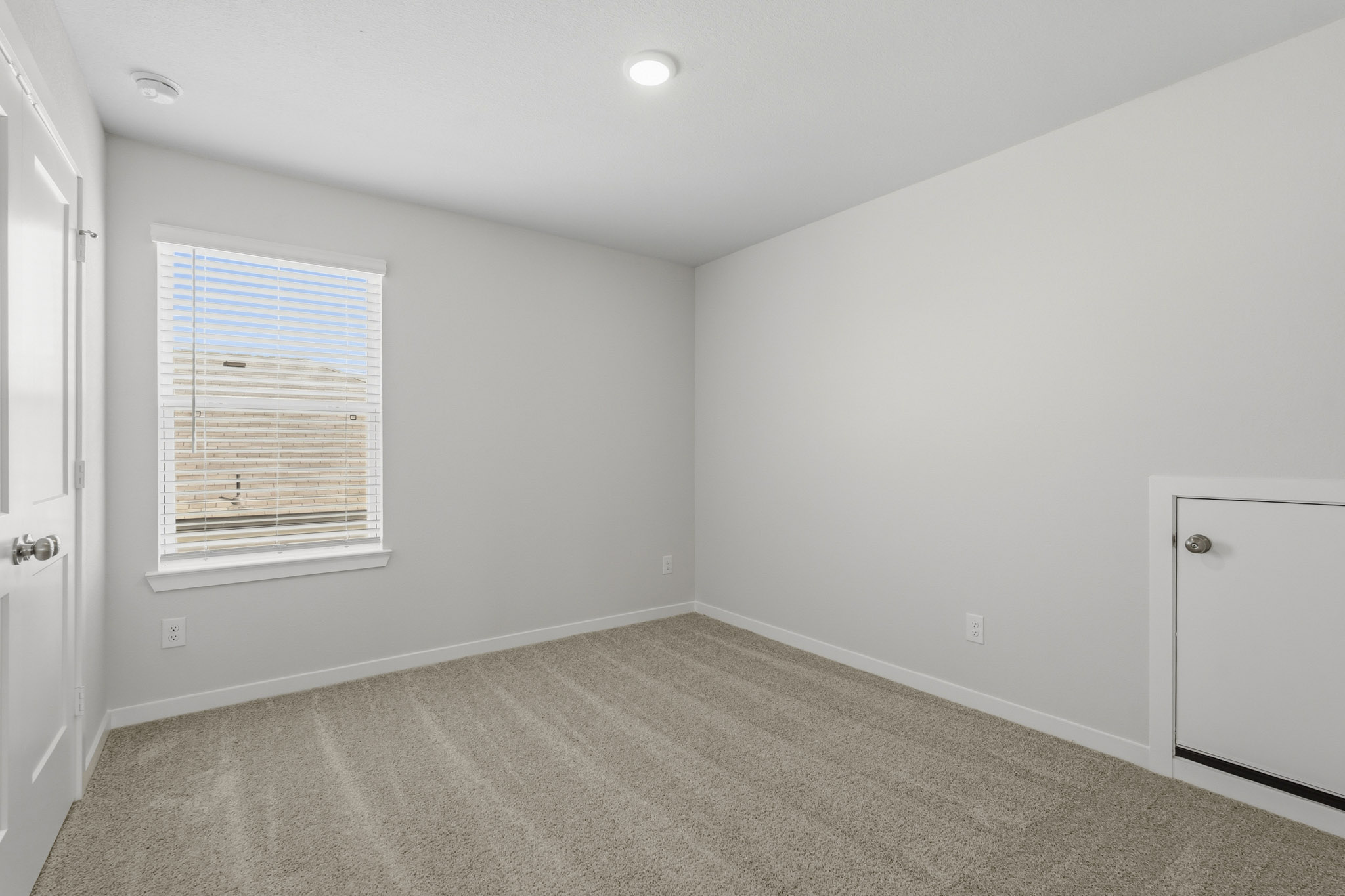 A room with a door and a window.