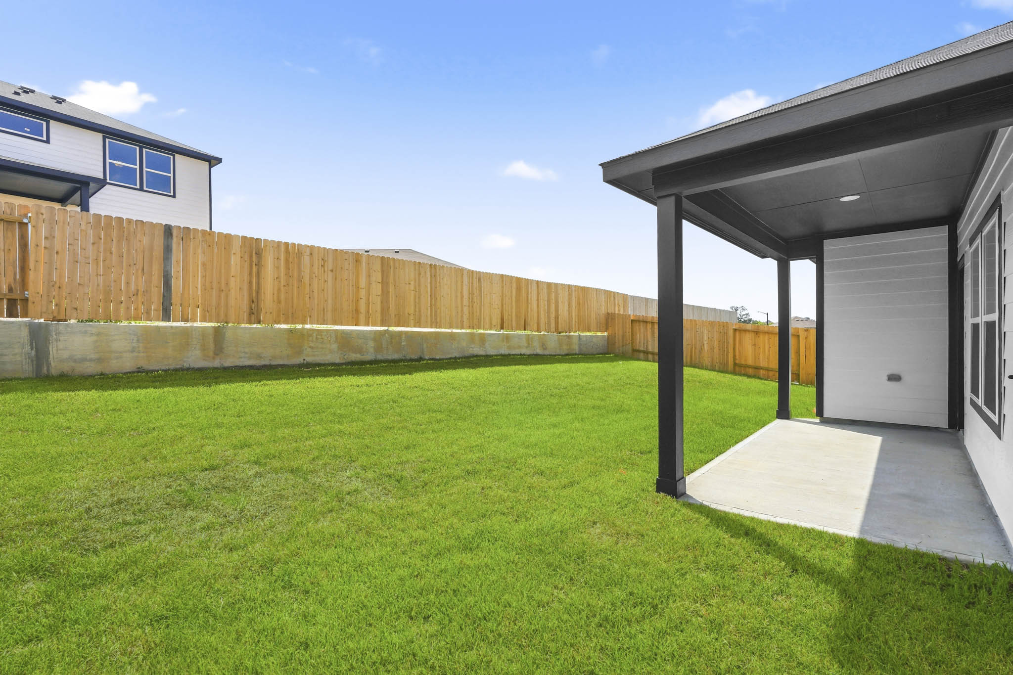 A building with a grass lawn.