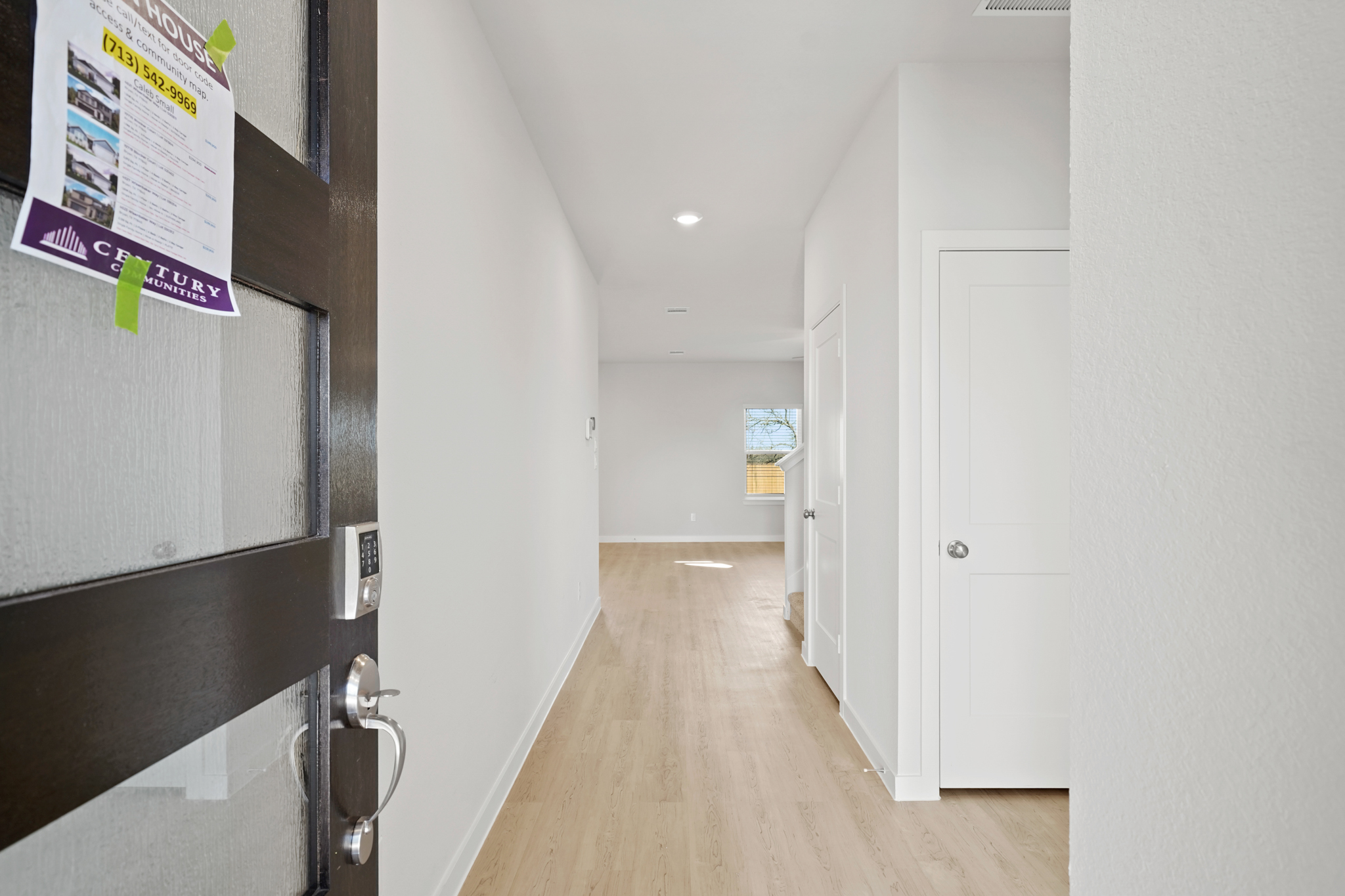 A hallway with white doors.