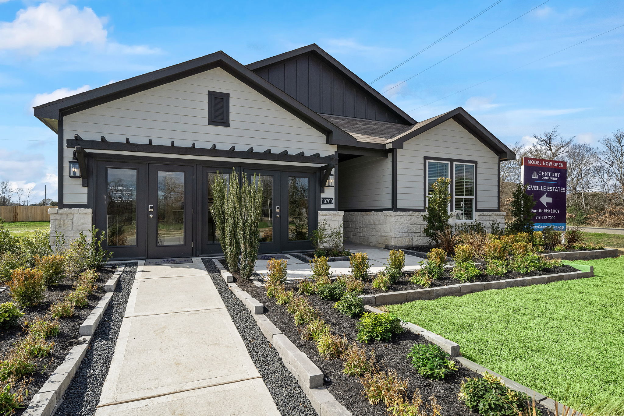 A house with a sign in front.