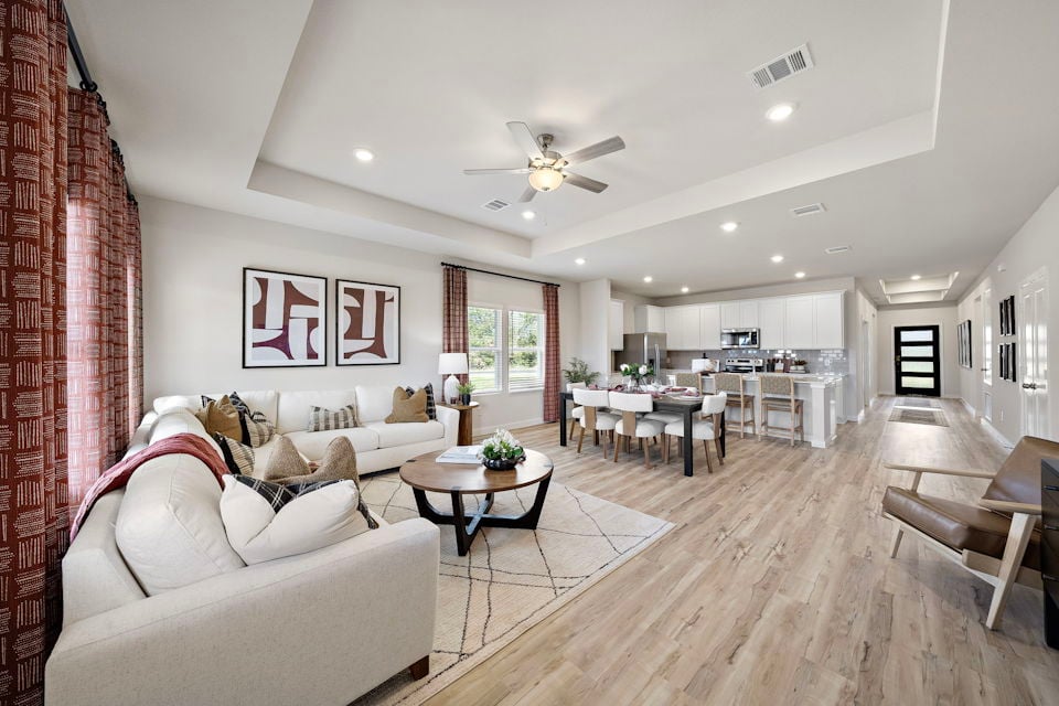 A living room with a wood floor.