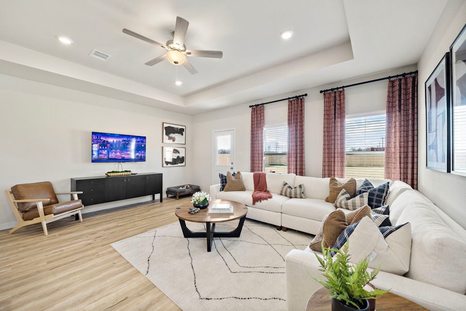 A living room with a large television.