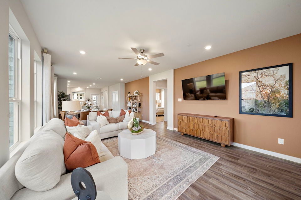 A living room with a couch and a table.