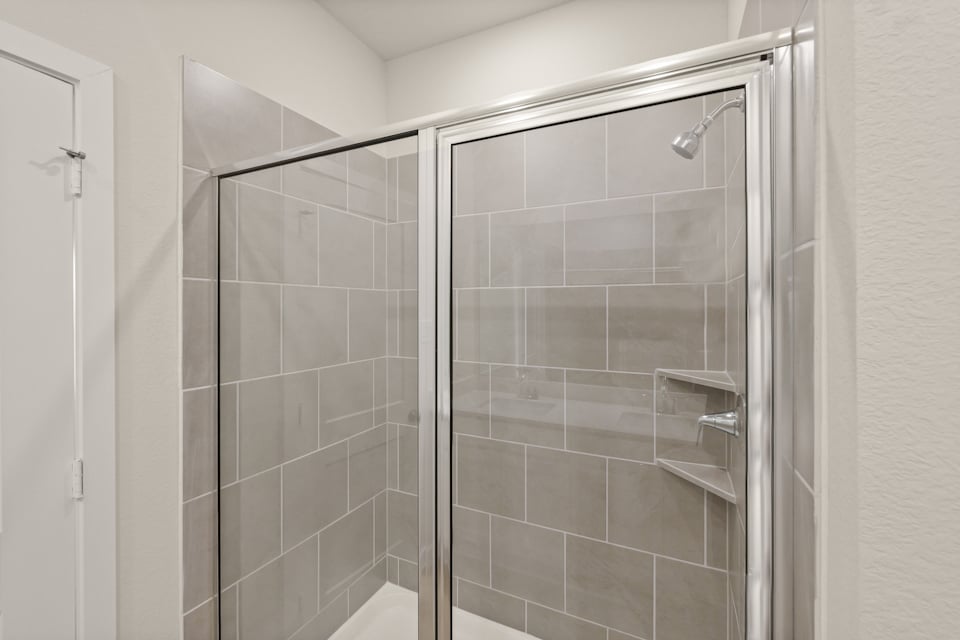 A shower unit in a bathroom.