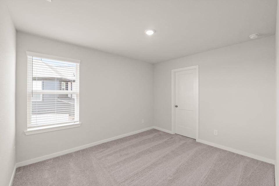 A room with a door and a window.