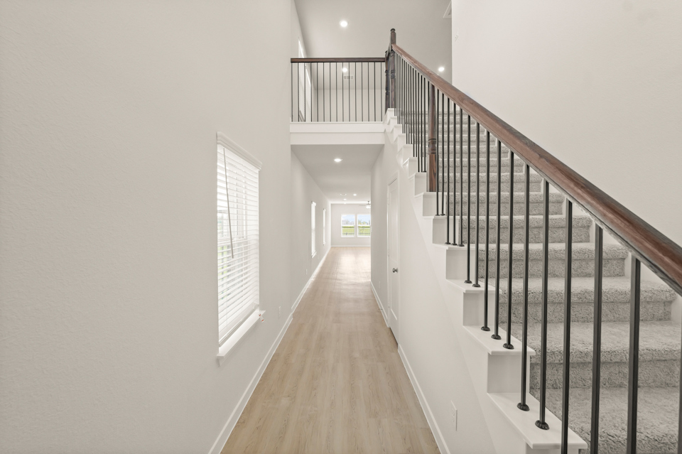 A long hallway with white walls.