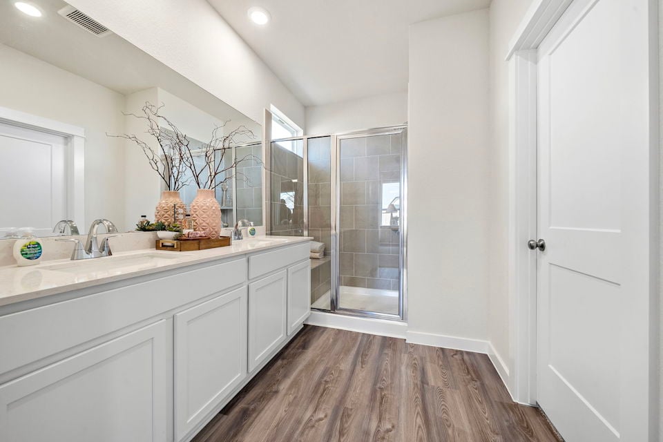 A bathroom with a glass shower.