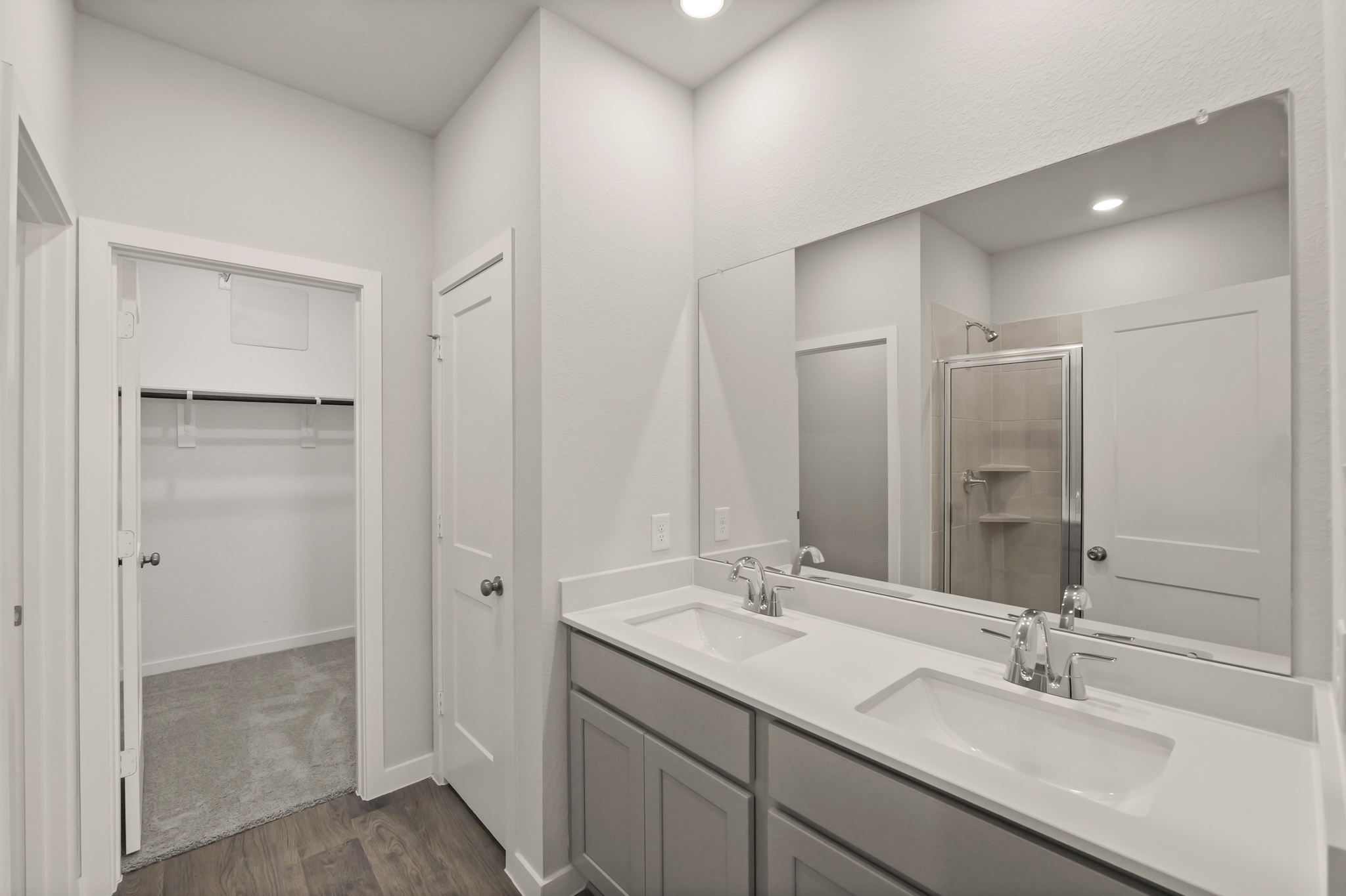 A bathroom with a glass shower.