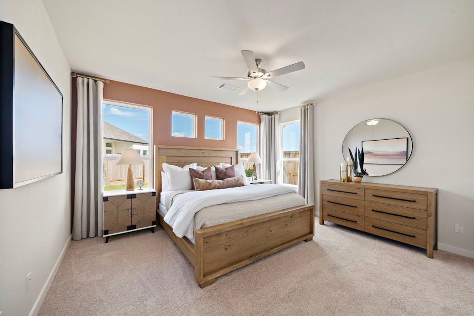 A bedroom with a large bed.