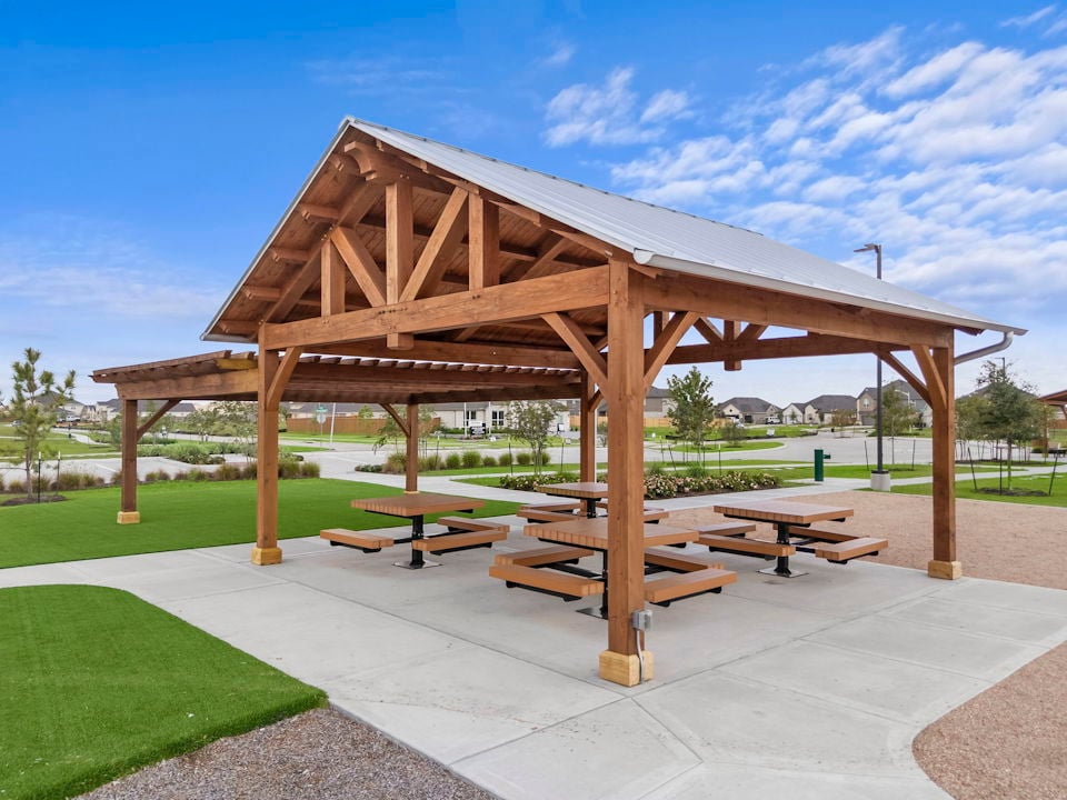 A gazebo with a picnic table.