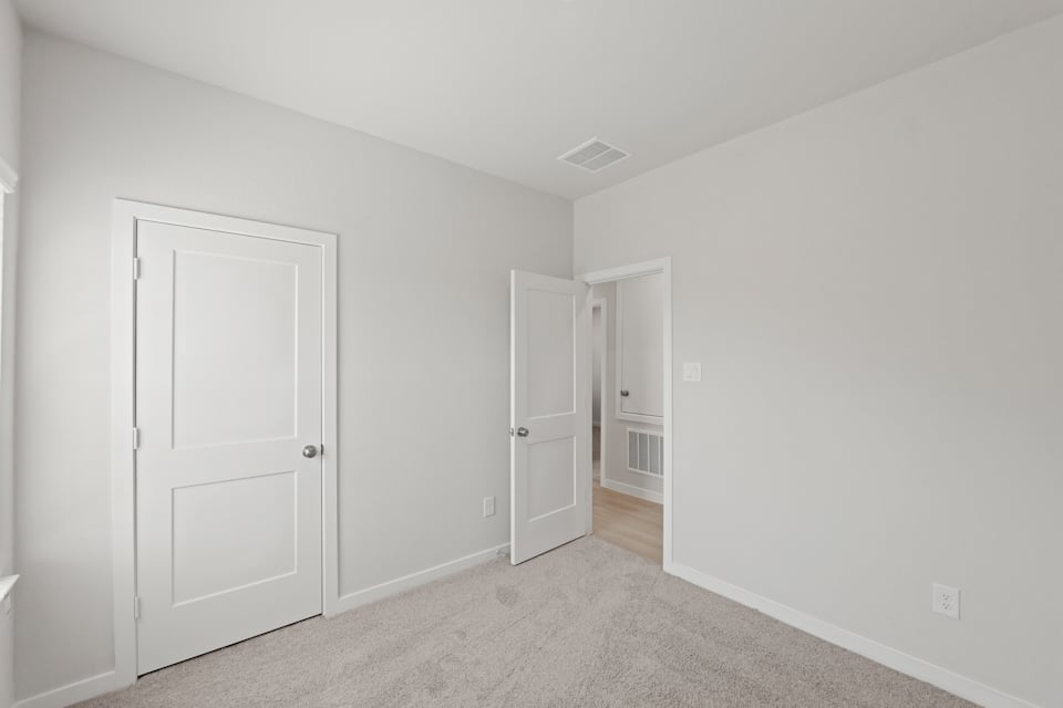 A room with white doors.