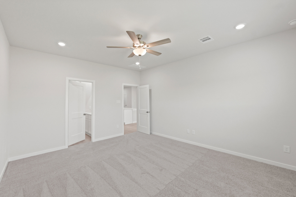 A room with a ceiling fan and a ceiling fan.