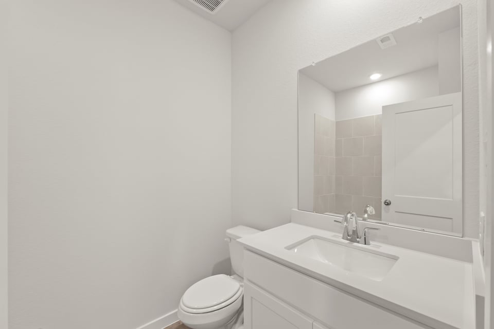 A bathroom with a sink and a toilet.