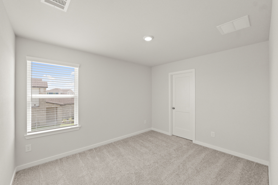 A room with a door and a window.