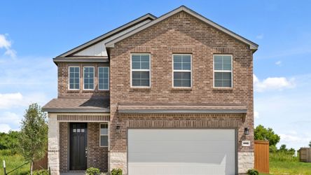 A brick building with a garage.