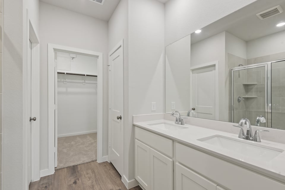 A bathroom with a large mirror.