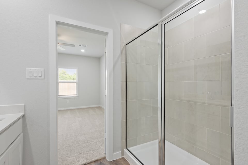 A bathroom with a glass shower.
