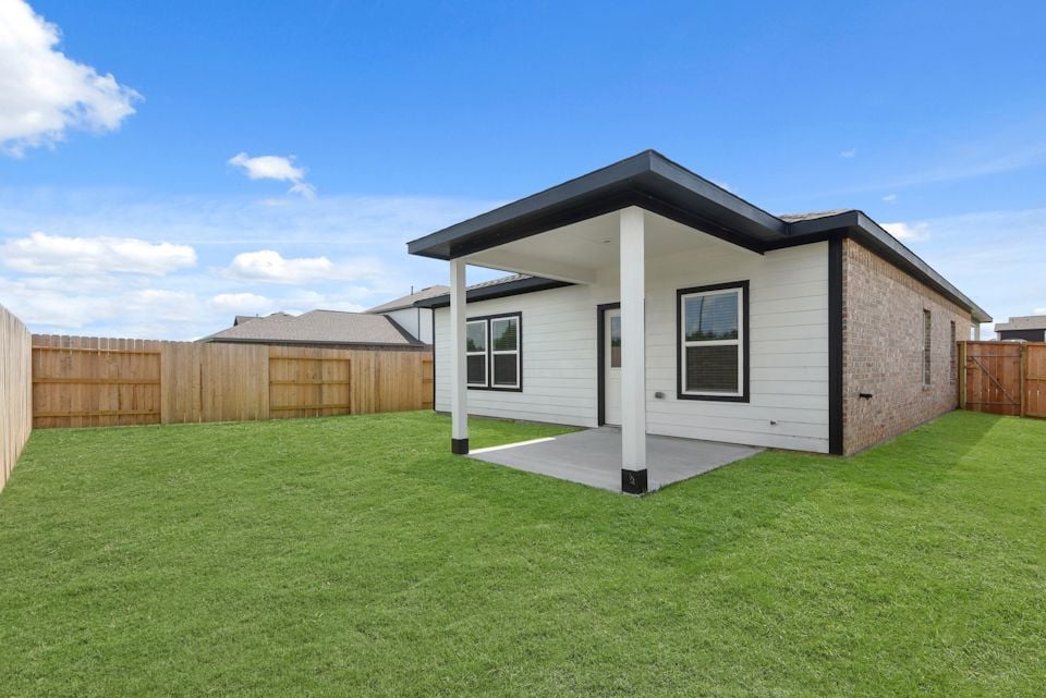 A house with a grass yard.