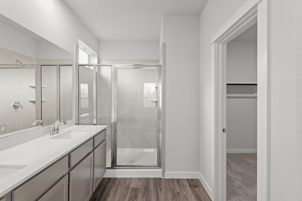 A bathroom with a glass shower.