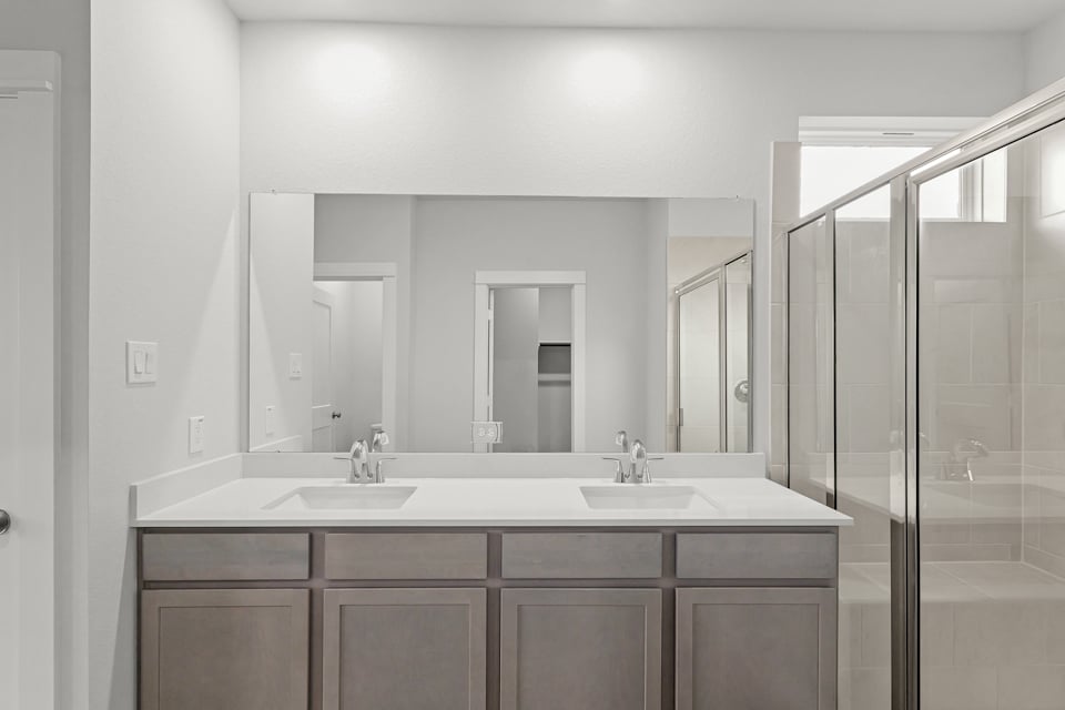 A bathroom with a glass shower.