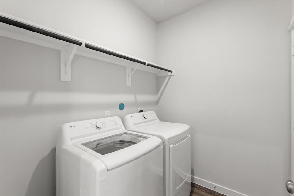 A washing machine in a room.