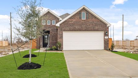 A large brick house with a garage.