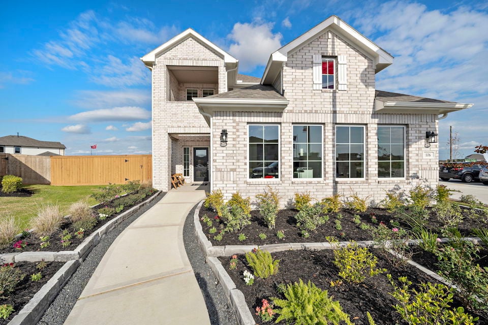 A white house with a driveway.