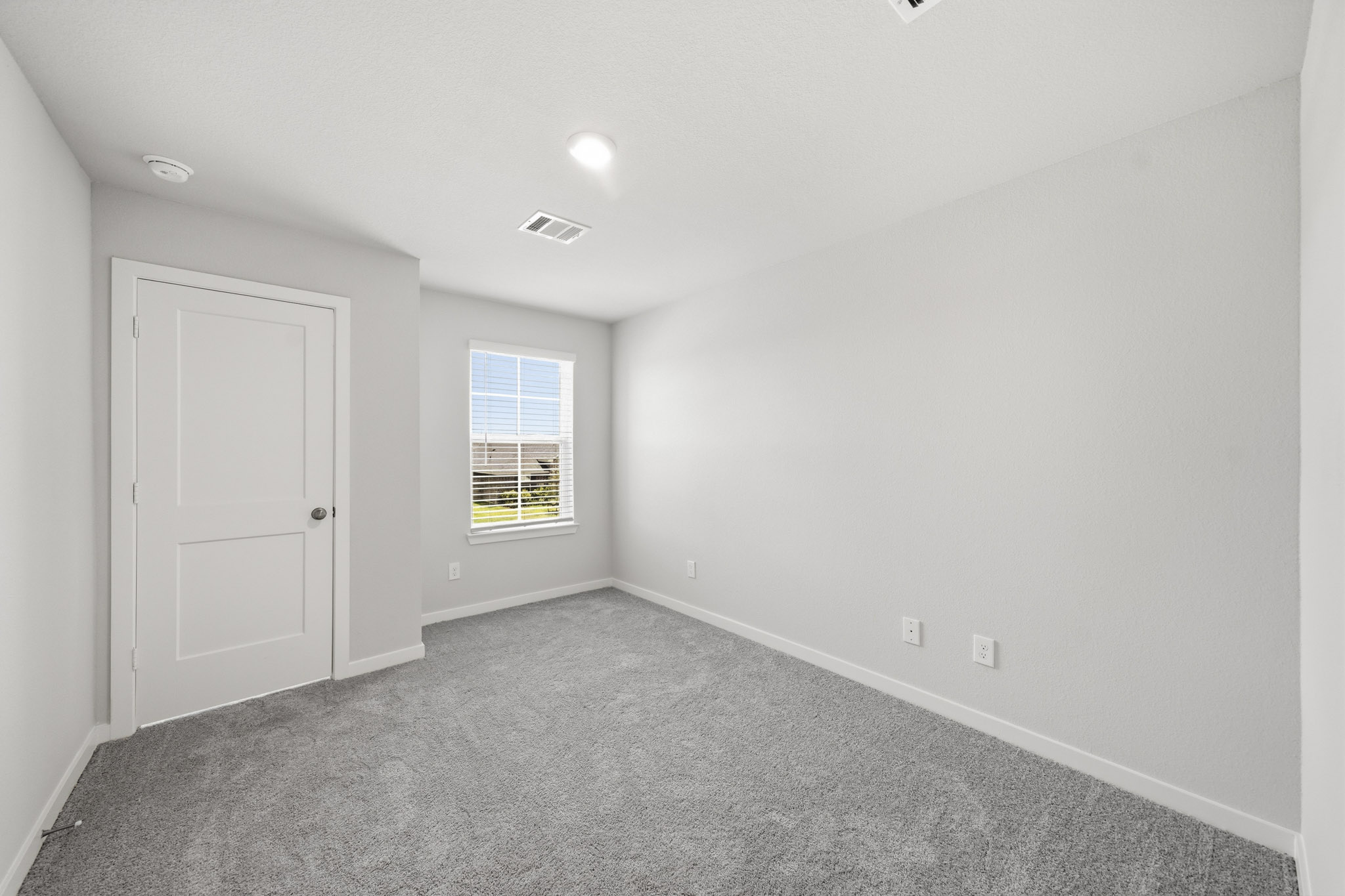 A room with a door and a window.