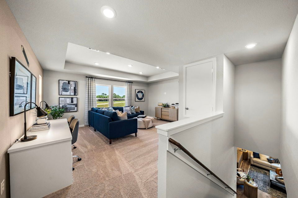 A living room with a couch and a table.